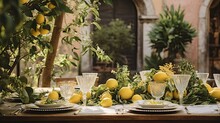 Wedding And Holiday In Italy. Festive  Party Decorated With Lemons.  Festive Table, Which Is Decorated With Lemons And Herbs, On The Table Are Plates, Glasses And Candles. 