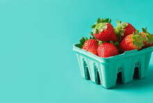 Ripe Juicy Fresh Strawberries In A Blue Carton On Turquoise Background. Summer Berries Healthy Lifestyle Farmers Market Produce