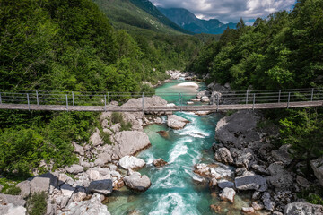 Canvas Print - Suspension bridge over alpine Soca river in Slovenia