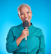 © Tshidzumba/peopleimages.com - Reporter woman, smile and microphone in studio portrait for news, announcement or talk show by blue background. Young African journalist, holding mic and happy tv host for speech, press or interview