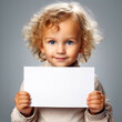 © 大輔 渡辺 - A Child holding a message board