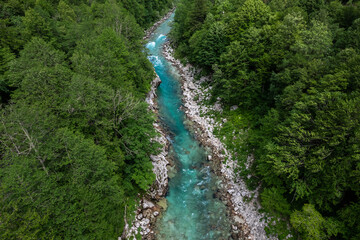 Canvas Print - Aerial drone view of Soca river and green lush landscape in Slovenia at summer