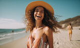Fototapeta Miasto - Happy smiling woman on beach holiday, wearing sun dress and hat clear sunny summer day with blue skies AI generated