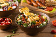Delicious salad added to grilled dishes, with bacon and halloumi cheese.