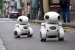 © ADDICTIVE STOCK - Generative AI futuristic illustration of white look alike android characters on asphalt pavement on asphalt road on street