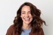 © Hanne Bauer - Portrait of a beautiful young woman laughing on a white background.