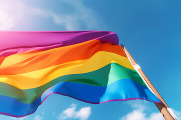 Aufkleber - A rainbow flag waving proudly against a blue sky, symbolizing LGBTQ+ pride and inclusivity.  Generative AI technology.