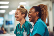 Candid shot of two nurses laughing and talking in a hospital, showcasing positivity and collegiality. Generative AI