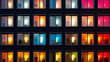 Building facade with the windows lighted in different colors