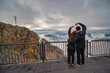 © Noppasinw - Zugspitze Peak top of Germany and Alps mountain range with love couple tourist, Garmisch Partenkirchen Germany