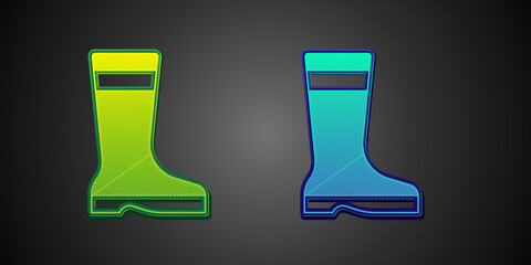 Poster - Green and blue Fishing boots icon isolated on black background. Waterproof rubber boot. Gumboots for rainy weather, fishing, hunter, gardening. Vector