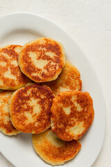 Chvishtari, corn flour tortillas with cheese, pastries, Georgian cuisine, Mchadi, homemade, top view, on a wooden table, no people,