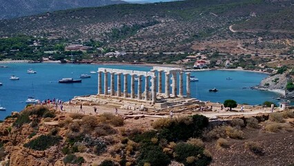 Wall Mural - Aerial closeup view of the Temple of Poseidon at Cape Sounion at the edge of Attica, Greece, during summer time