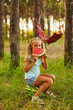 © Inna Vlasova - Cute girl eating watermelon at park in the forest
