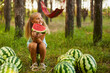 © Inna Vlasova - Cute girl eating watermelon at park in the forest