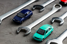 Shallow Depth Of Field, A Car In The Foreground And Wrenches