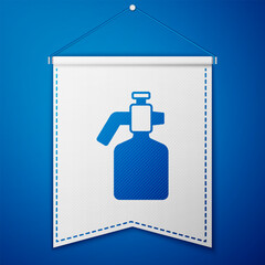 Poster - Blue Paint spray gun icon isolated on blue background. White pennant template. Vector