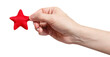 Male hand holding a red small star, cut out