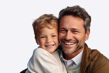 Portrait of a smiling father and his son on a white background. Ai generated.