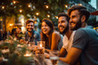© MVProductions - Group of friends laughing and enjoying dinner at outdoor restaurant during summer, generative ai