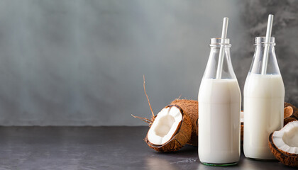 Wall Mural - Coconut vegan milk non dairy in different bottles with copy space