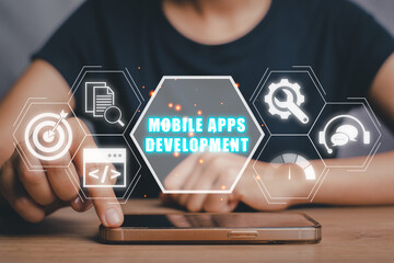 Mobile apps development concept, Person hand touching on smart phone on desk with mobile apps development icon on virtual screen.