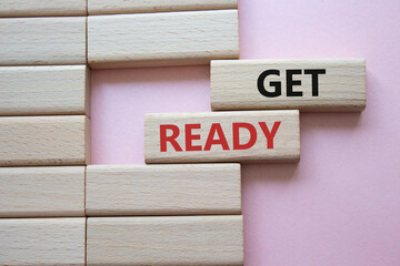 Wall Mural - get ready symbol. wooden blocks with words get ready. beautiful pink background. business and get re