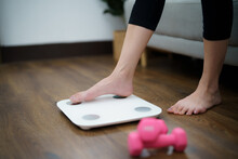 Fat Diet And Scale Feet Standing On Electronic Scales For Weight Control. Measurement Instrument In Kilogram For A Diet Control