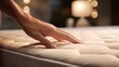 Close-up of hand on a mattress