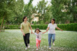 © boytsov - Smiling Family Running Across Summer Field Together. Mother Daughter son, hands together High quality photo