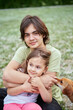 © boytsov - Brotherhood, sisterhood, siblings, family concept. Loving cheerful boy brother hugging his pretty smiling sister, cuddling over outdoor background. High quality photo