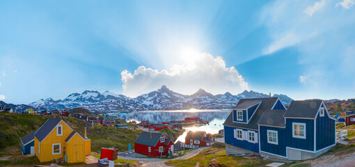 Wall Mural - Picturesque village on coast of Greenland - Colorful houses in Tasiilaq, East Greenland