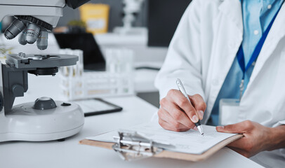 Canvas Print - Research, writing and science with hands of man in laboratory for report, pharmacy and medical. Checklist, healthcare and medicine with closeup of scientist and clipboard for data, vaccine and study