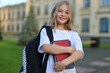 © Andrii Zastrozhnov - Back to school, first grader girl with a backpack and notebooks.