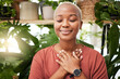 © Lategan/peopleimages.com - Zen, breathing and calm woman by plants for breathing exercise in meditation in a nursery. Breathe, gratitude and young African female person with a relaxing mindset by an indoor greenhouse garden.