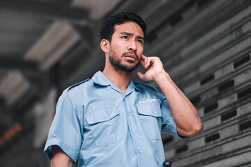 Poster - Security guard, serious and safety officer man on the street for protection, patrol or watch. Law enforcement, focus and duty with a crime prevention male worker in uniform to listen communication