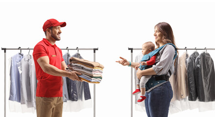 Poster - Courier delivering a pile of folded clothes to a mother with a baby