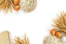 Cheese, Barley And Wheat And Eggs On A White Background With Space For Text. Top View, Flat Lay