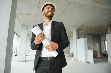 Wall Mural - Portrait of a Indian engineer posing at the camera