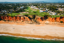 Aerial Drone View Of Praia De Vale Do Lobo With Magnificent Golf Courses Overlooking The Ocean In Algarve, Portugal
