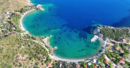 Wall Mural - Aerial drone video unveiling the scenic splendor of Hayıtbükü Bay, with its clear turquoise waters and lush landscape in Datça, Muğla, Turkey.