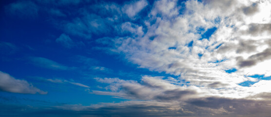 Wall Mural - Blue sky with clouds at sunrise or sunset shot at 14 mm focal length