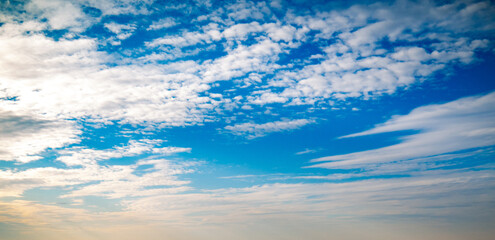 Wall Mural - blue sky with variety of clouds at all altitudes shot at 28 mm focal length