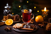 A Glass Of Mulled With Cinnamon And An Orange Slice.