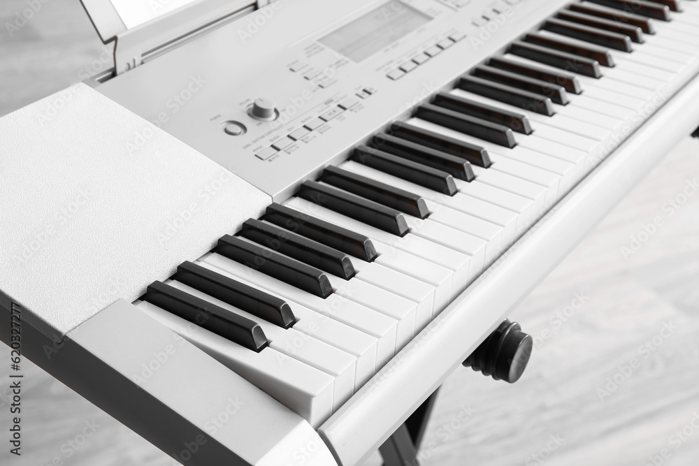 Modern synthesizer in room, closeup