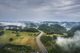 Fototapeta Miasto - Road, highway across foggy mountains in Tennessee. Little Sycamore, Tennessee empty highway.
