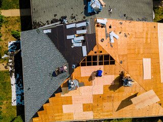 Wall Mural - During repair work on apartment buildings roof old shingles were replaced plywood and new shingles were installed.