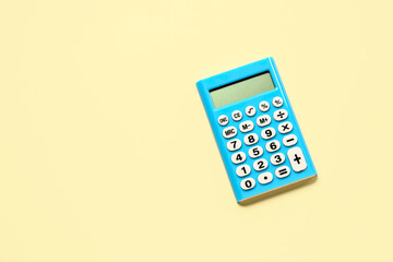 Wall Mural - Modern calculator on pale yellow background