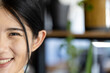 © Wavebreak Media - Half portrait of happy asian casual businesswoman smiling in office, copy space