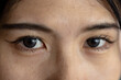 © Wavebreak Media - Portrait close up of eyes of happy asian casual businesswoman in office